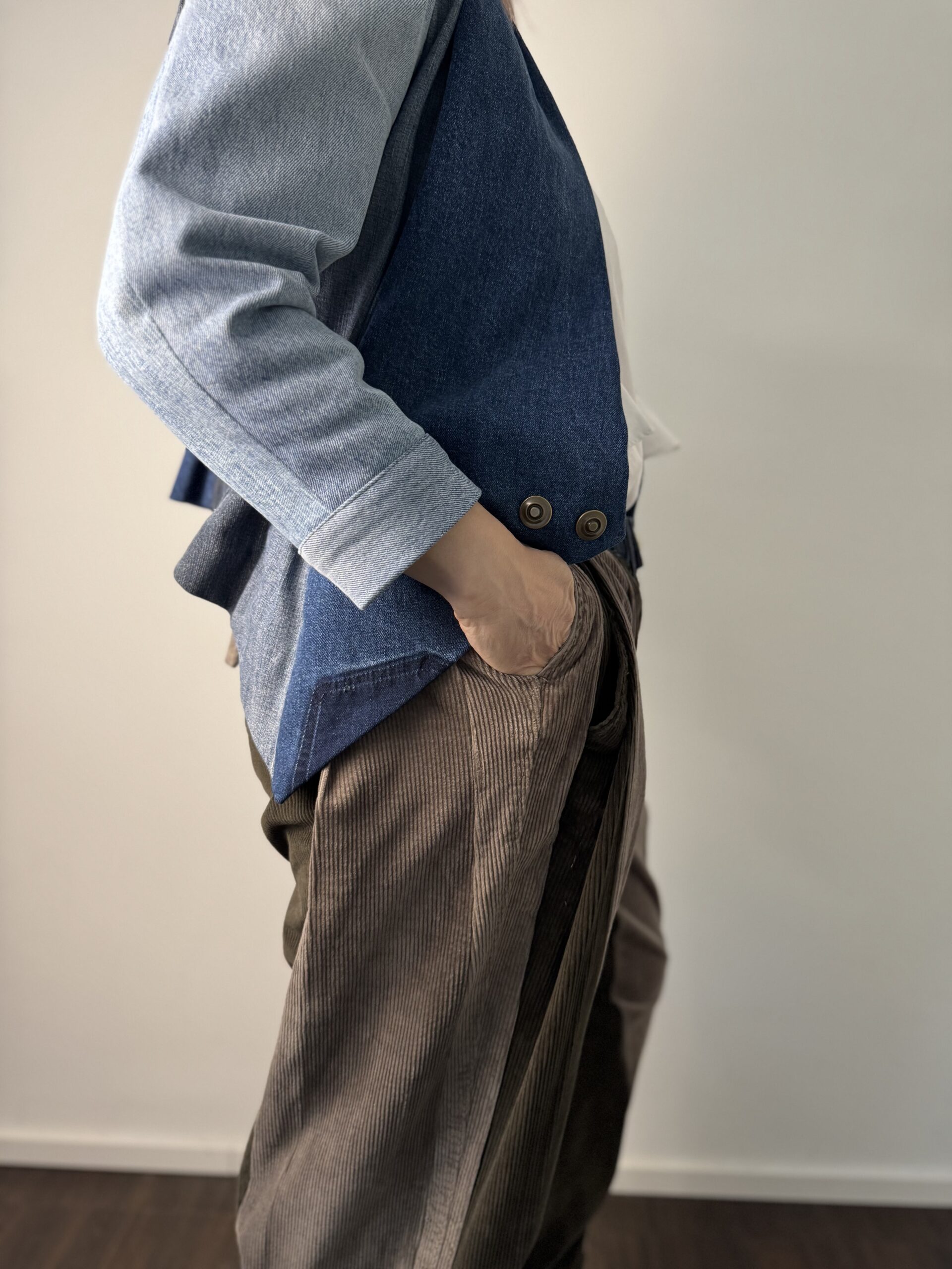 Four blues jeans blazer jacket upcycled from four preloved torn jeans.