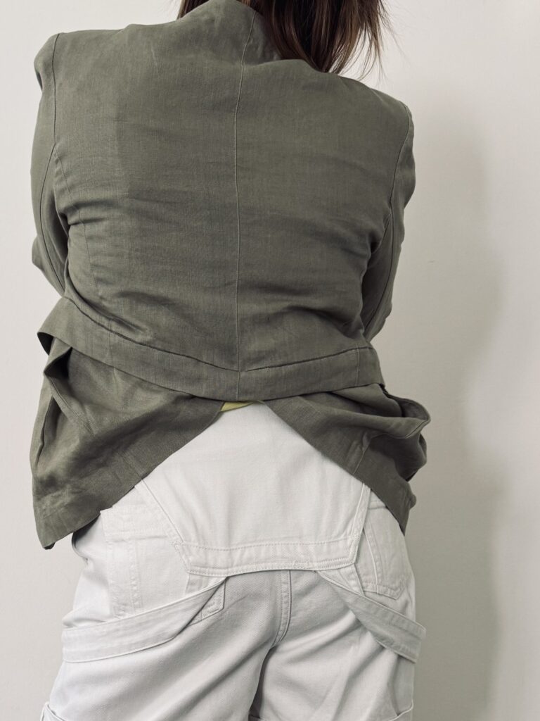 olive green blazer with hidden pockets and tulip downer part. Back.