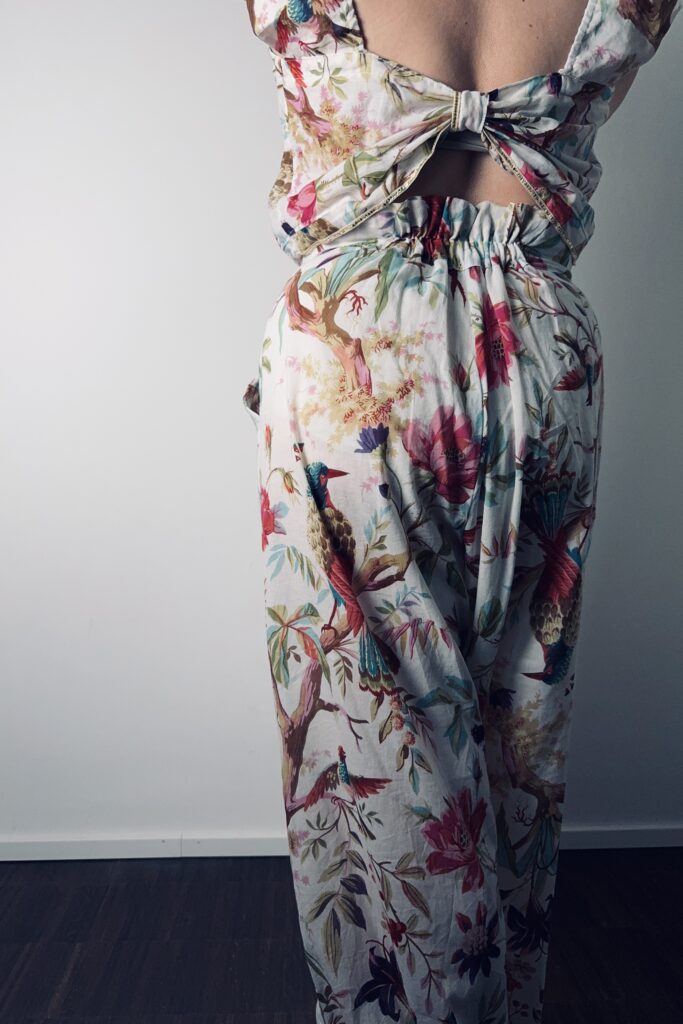 Clothes from Curtains. Wide leg skirt-pants in floral print upcycled from curtains. Back view.